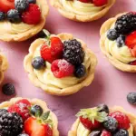 Berry tarts with fresh mixed berries and a creamy filling
