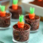 Brownie Carrot Patch Easter dessert with brownie crumbs and frosting carrots