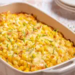 Corn casserole with cream cheese in a baking dish