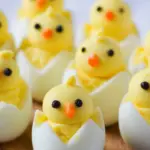 Deviled Egg Chicks with carrot beaks and olive eyes