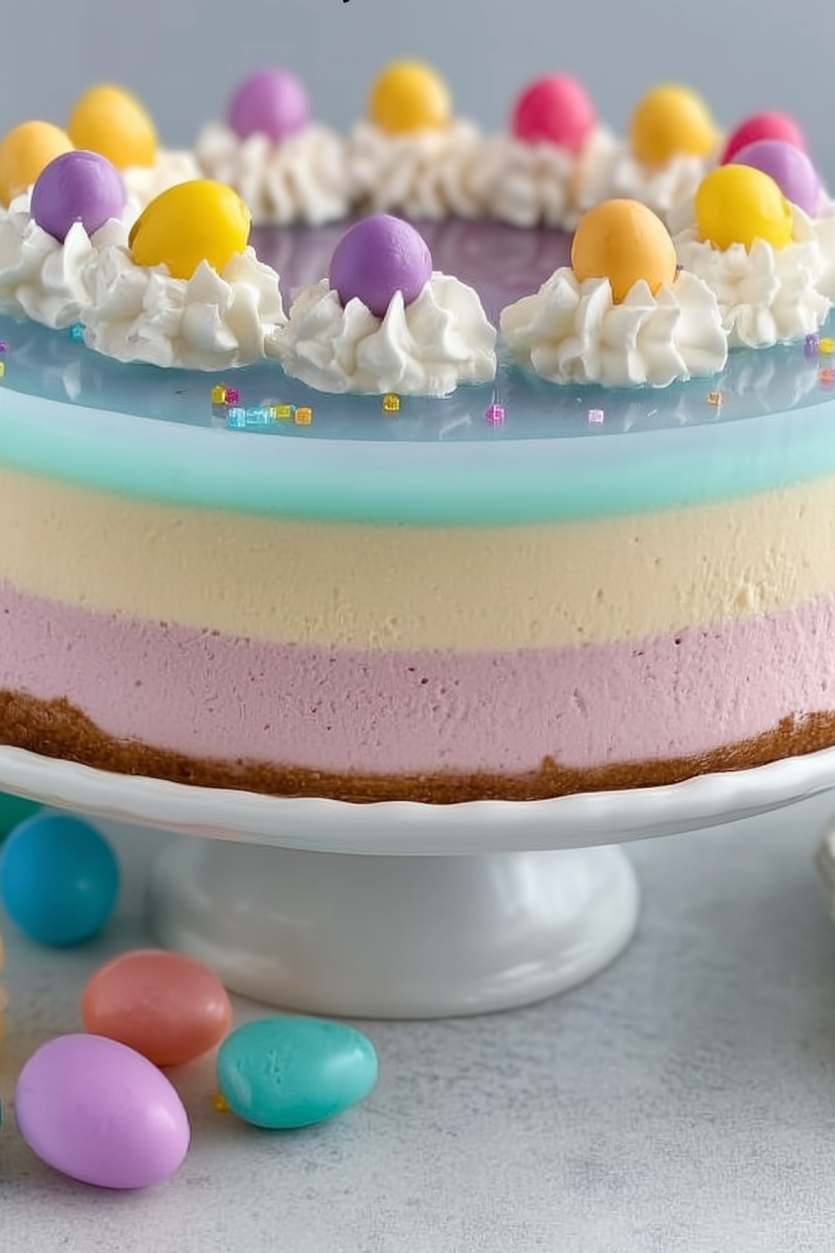 Easter JELLO Cheesecake with colorful layered gelatin and creamy filling