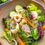 Garden salad with calamari served with fresh greens and citrus dressing