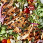 Grilled Chicken Salad with fresh vegetables and goat cheese