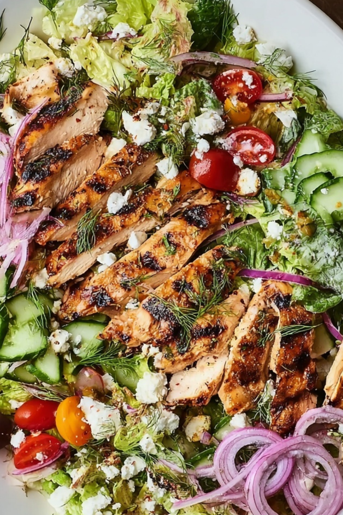 Grilled Chicken Salad with fresh vegetables and goat cheese