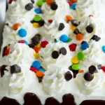 Ice Cream Sandwich Cake with chocolate chips and M&Ms