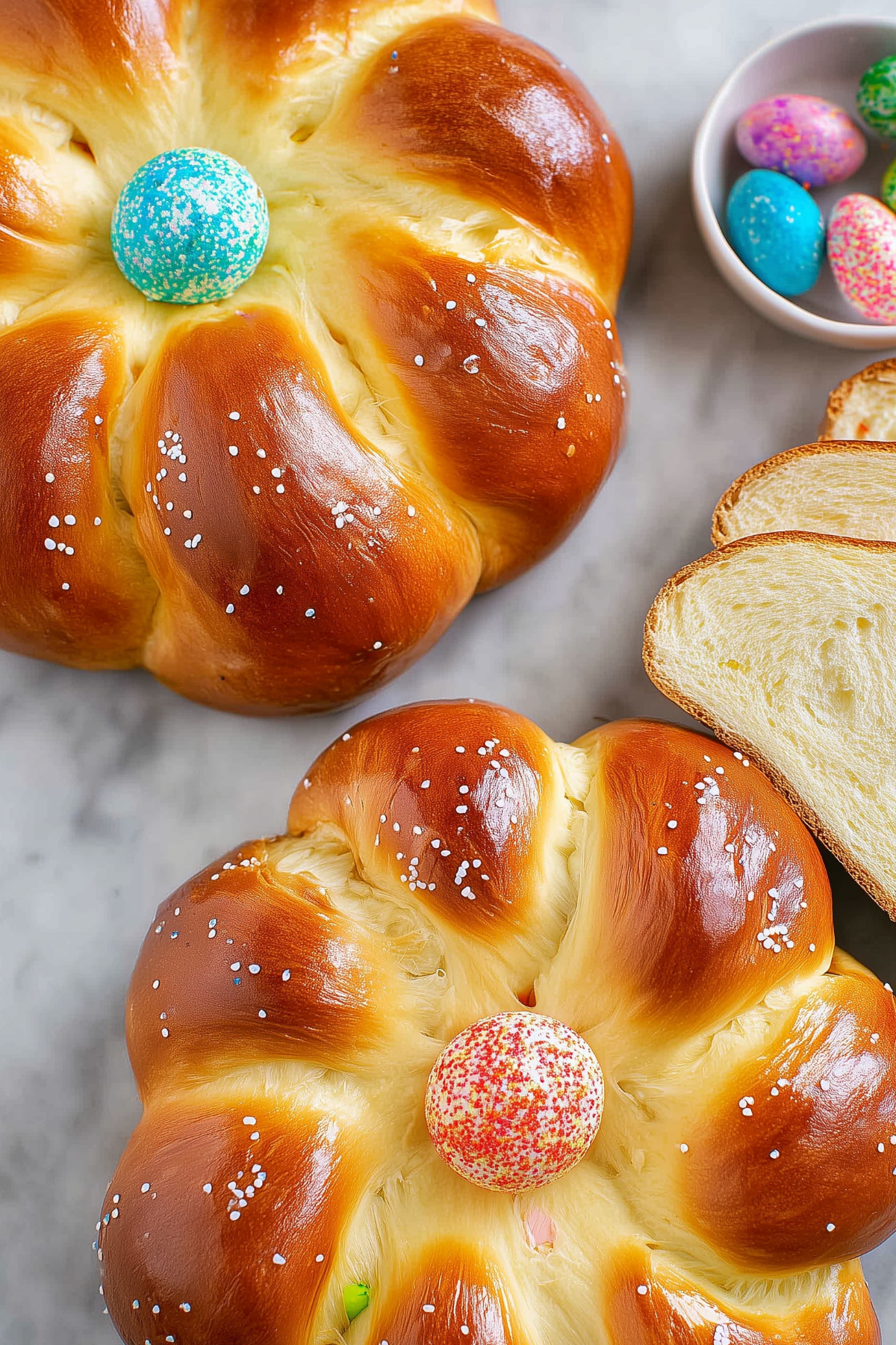 Italian Easter Bread decorated with colorful sprinkles and a hard-boiled egg in the center