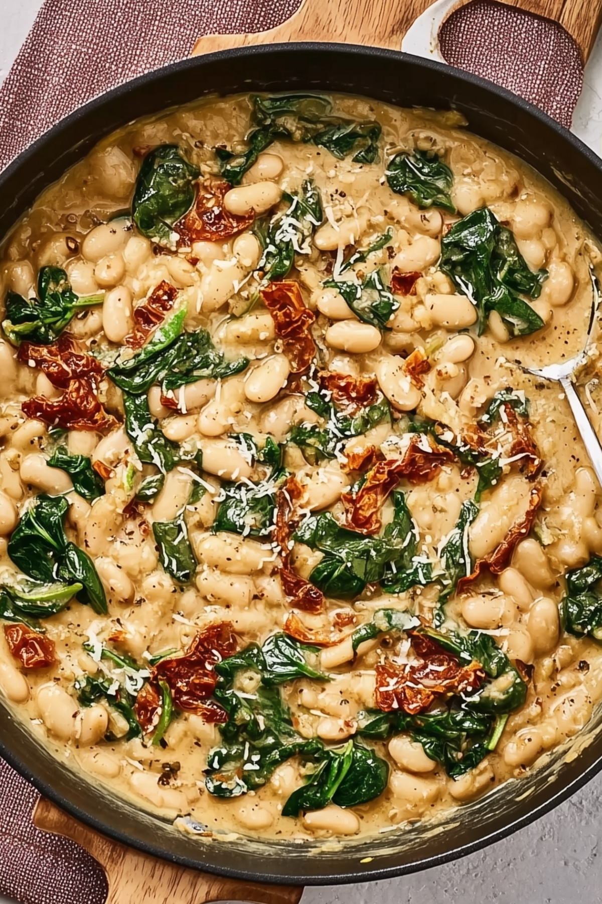 Marry Me White Bean & Spinach Skillet with creamy sauce and fresh spinach