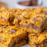 Mouthwatering Butterfinger Cookie Bars with creamy peanut butter icing