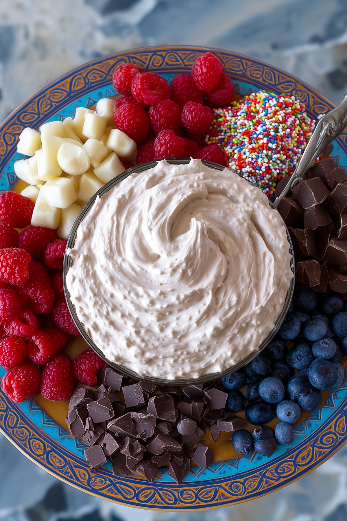 Creamy chocolate protein fluff in a bowl topped with berries