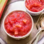 Homemade Rhubarb Sauce in a bowl with fresh rhubarb