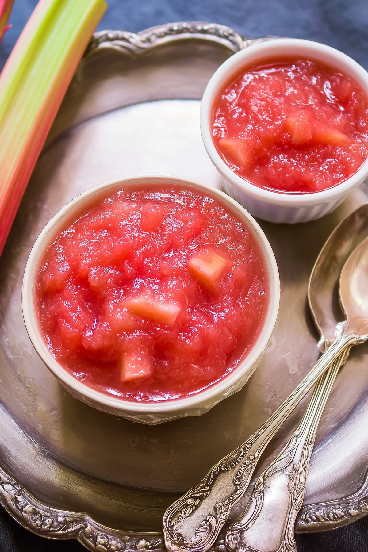 Homemade Rhubarb Sauce in a bowl with fresh rhubarb