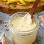 Roasted garlic aioli served with fries and vegetables
