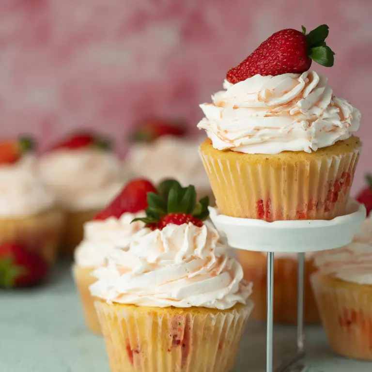 Strawberry Filled Cupcakes with fresh strawberry center and creamy frosting
