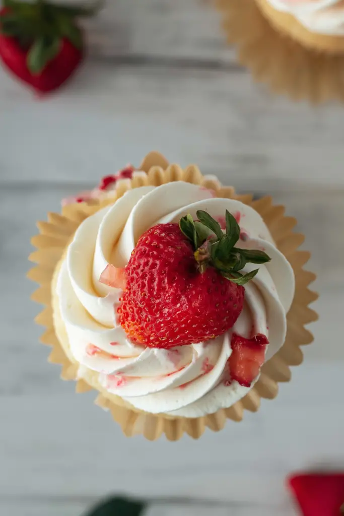 Strawberry Filled Cupcakes with fresh strawberry center and creamy frosting