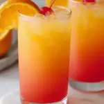 Sunrise Mocktail recipe with vibrant layers of orange juice and grenadine