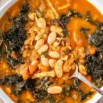 Tuscan White Bean Soup served in a bowl with a spoon